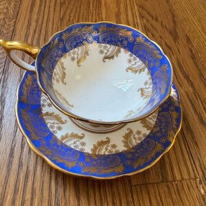 Elegant Blue and Gold Teacup and Saucer Set